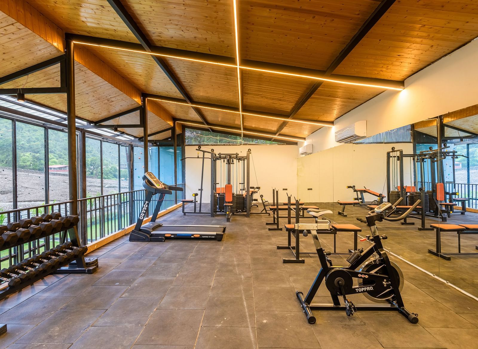 Gym area at DLS Divine River Resort and Spa with various exercise equipments 